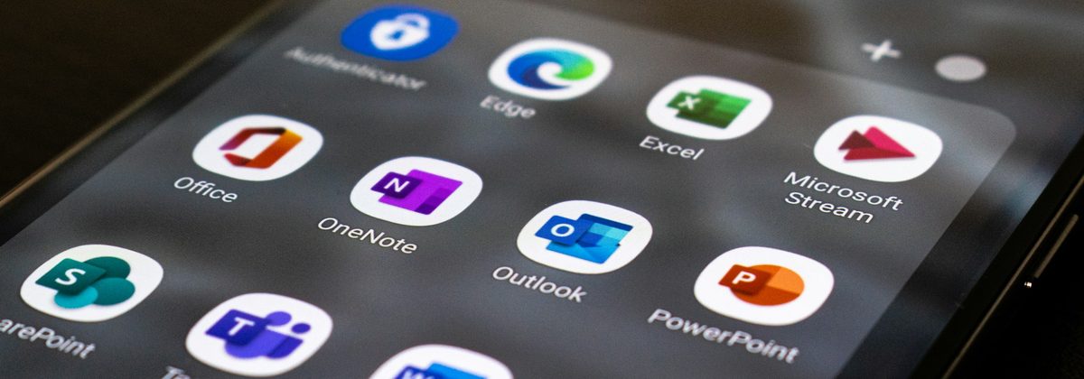Phone screen with the Microsoft 365 apps and the Outlook icon in the centre